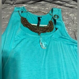 New turquoise color too with layered necklaces and crystal pendant